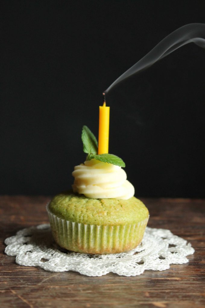 A cupcake with a blown out candle.