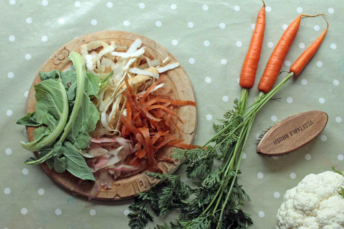 vegetable peelings on a wooden tray