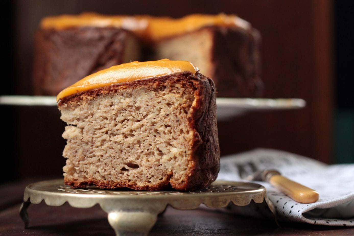 A close up of a slice of cake sitting on top of a table.