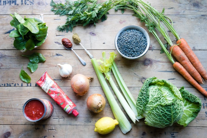 Ingredients for easy vegan slow cooker lentil stew with harissa paste. Gluten free and full of vegetables.