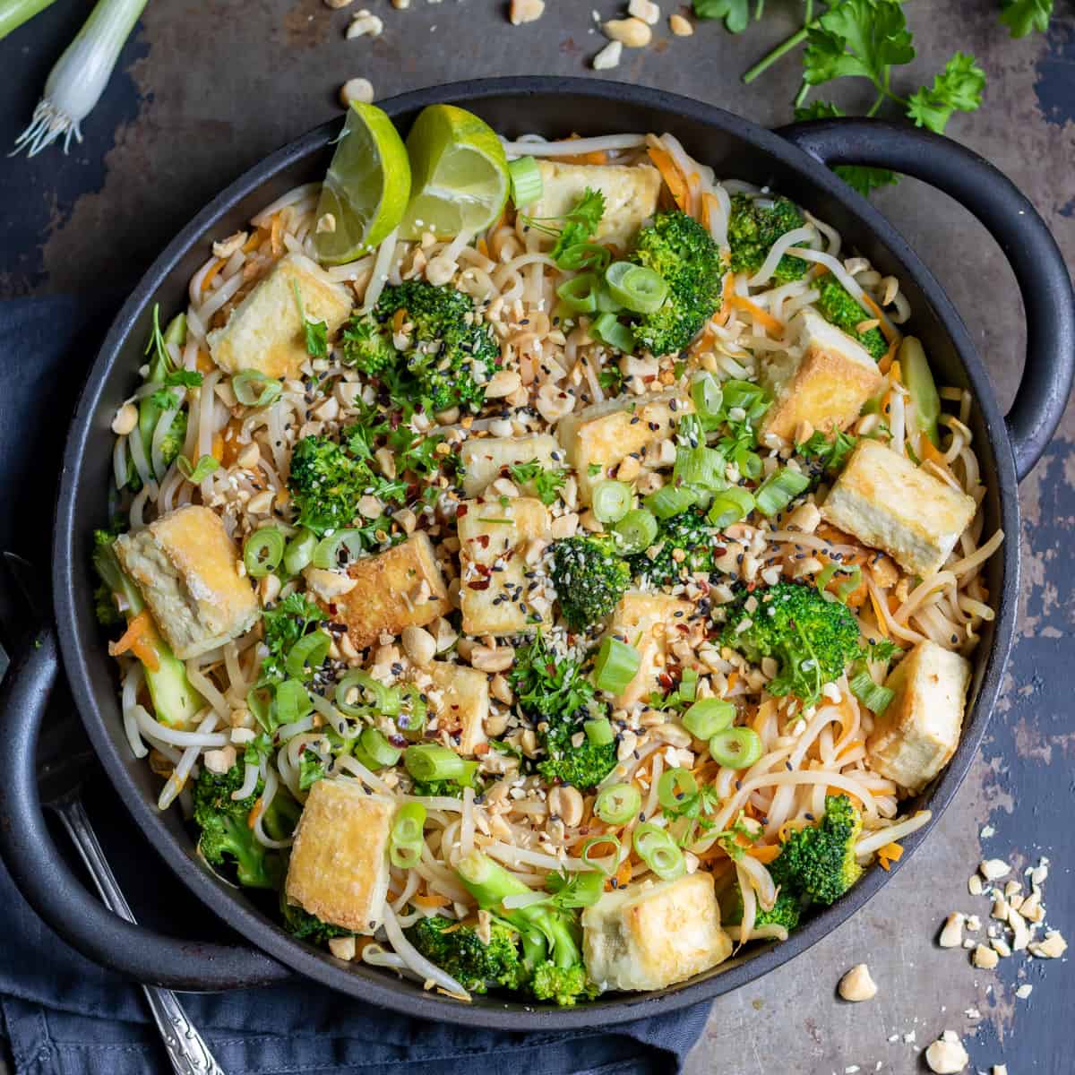 Dish of vegan pad thai on a table.