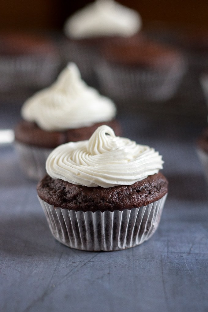 Close up of an easy vegan chocolate cupcake with vanilla frosting