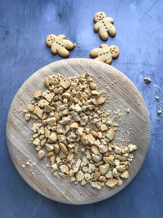 Crushed cookies on a cutting board.