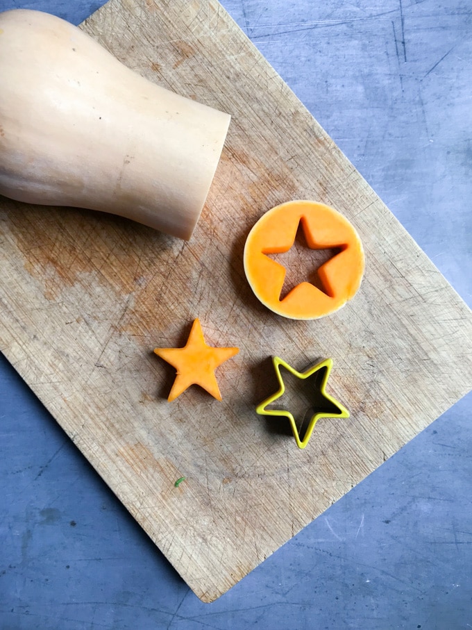 How to make roasted sprout side dish = cut a slice of the butternut squash and use a cookie cutter to cut a star shape