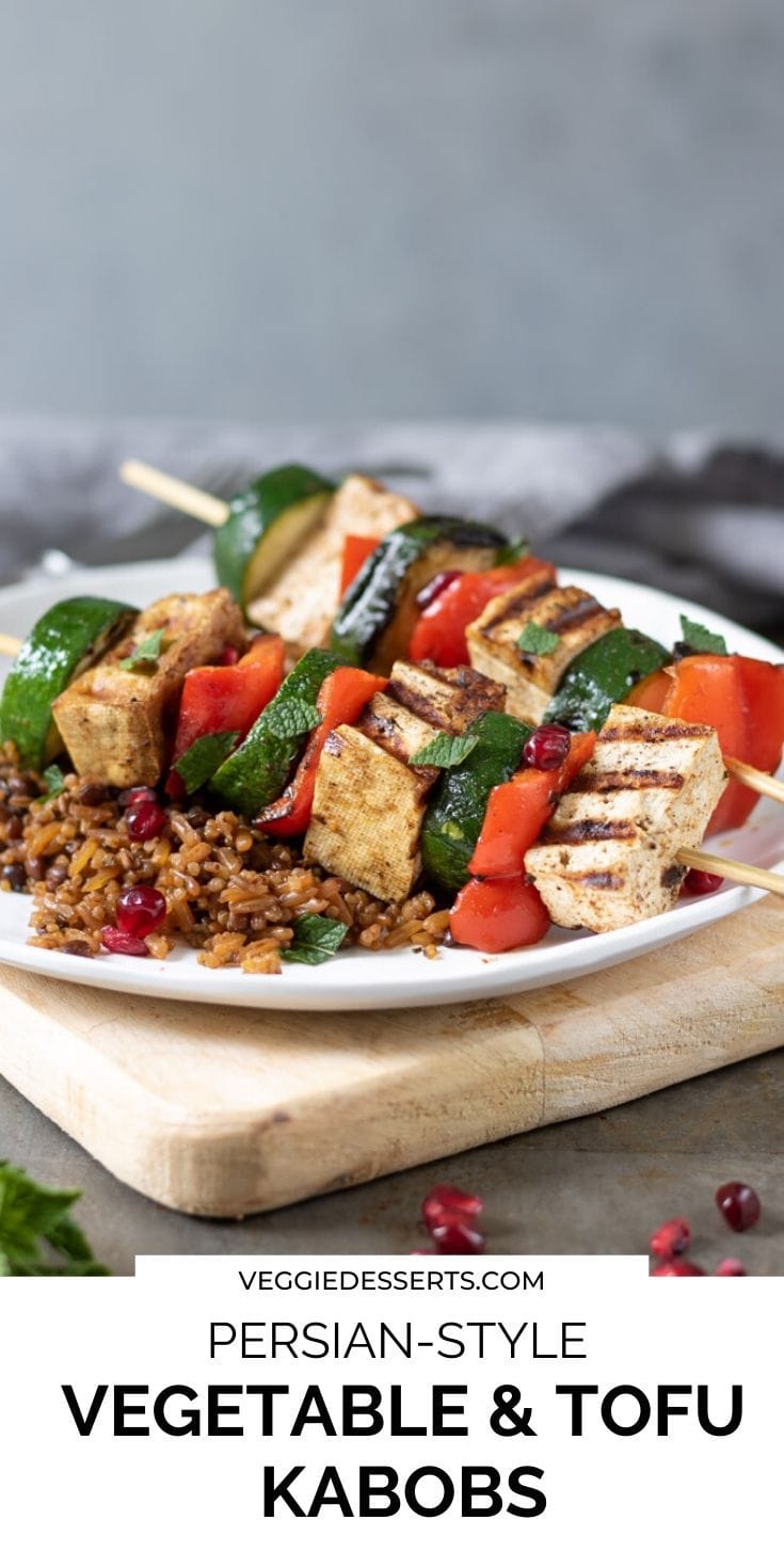 Tofu veg skewers on a plate, text overlay for pinterest