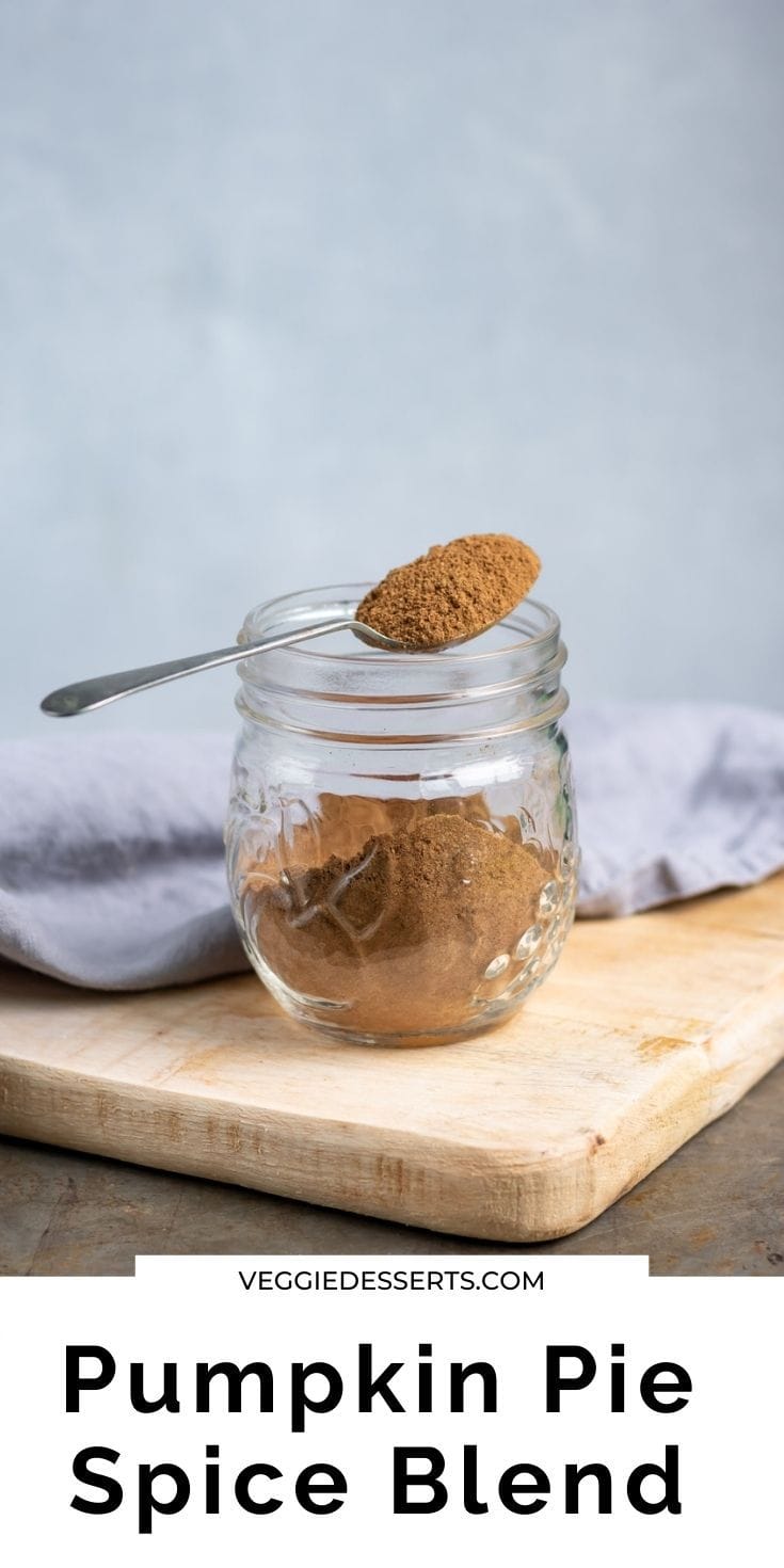 Jar of spice with spoon on top, text reads pumpkin pie spice blend.