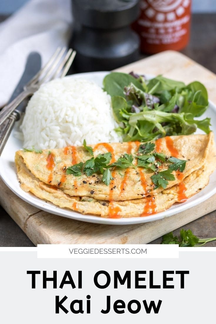 Omelet on a plate with rice and salad, text reads Thai Omelet, Kai Jeow.