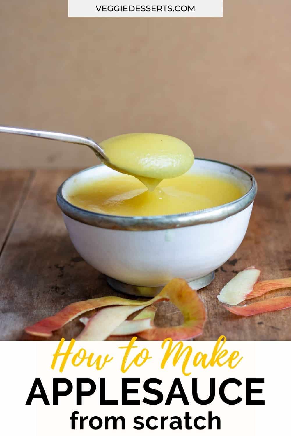 Spoon coming out of a bowl of applesauce.