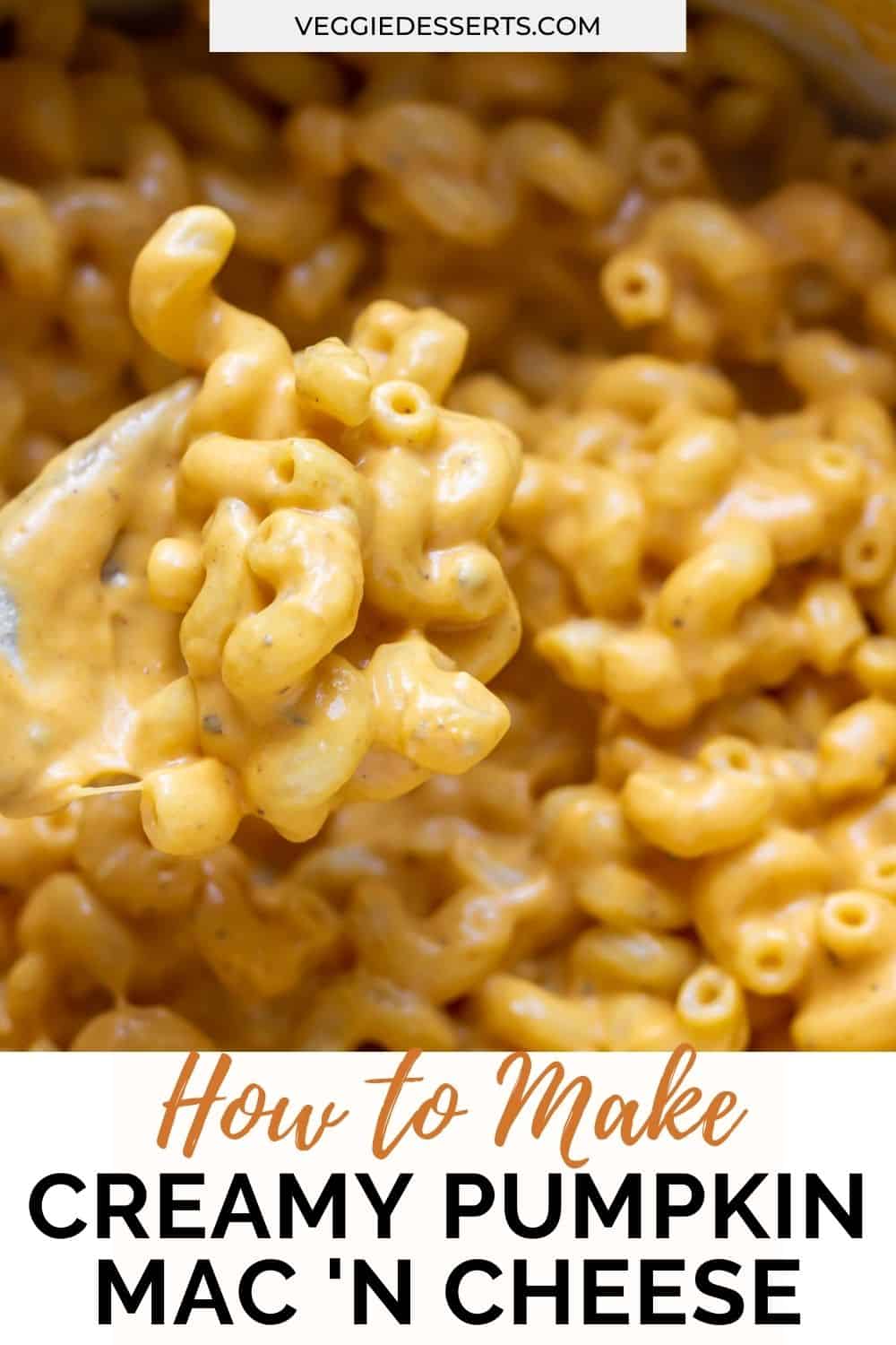 Close up of a wooden spoon in a pot of pasta with text: How to make creamy pumpkin mac and cheese.
