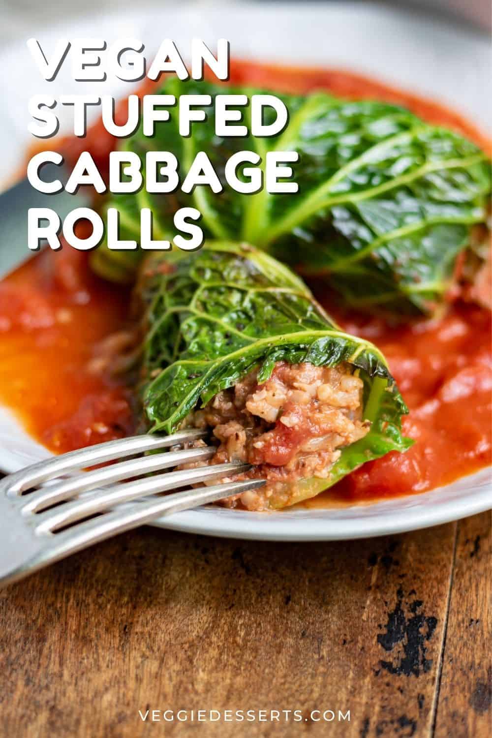Close up of a cut open cabbage roll, with text: vegan stuffed cabbage rolls.