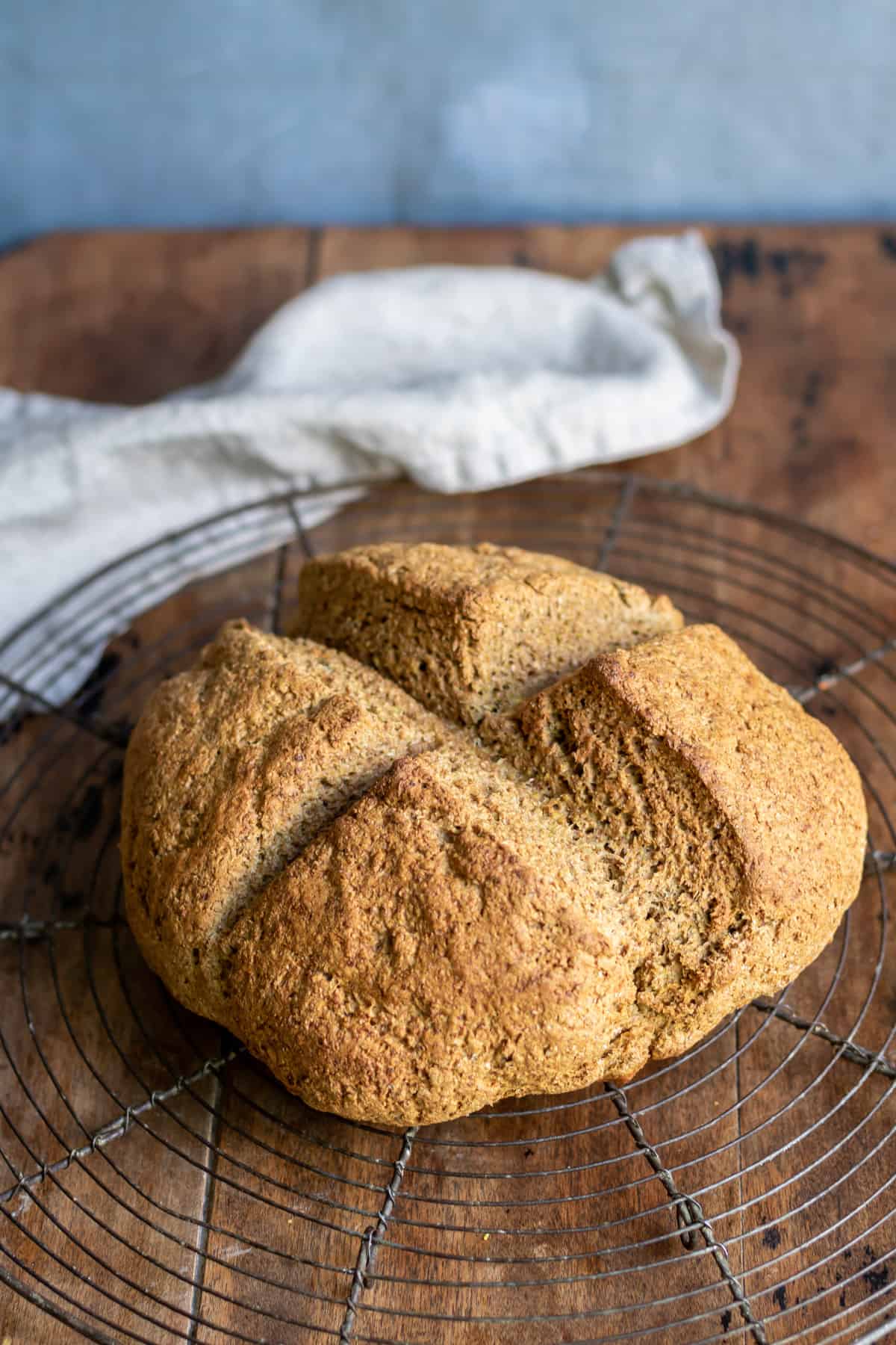 A loaf of bread on a wooden table.
