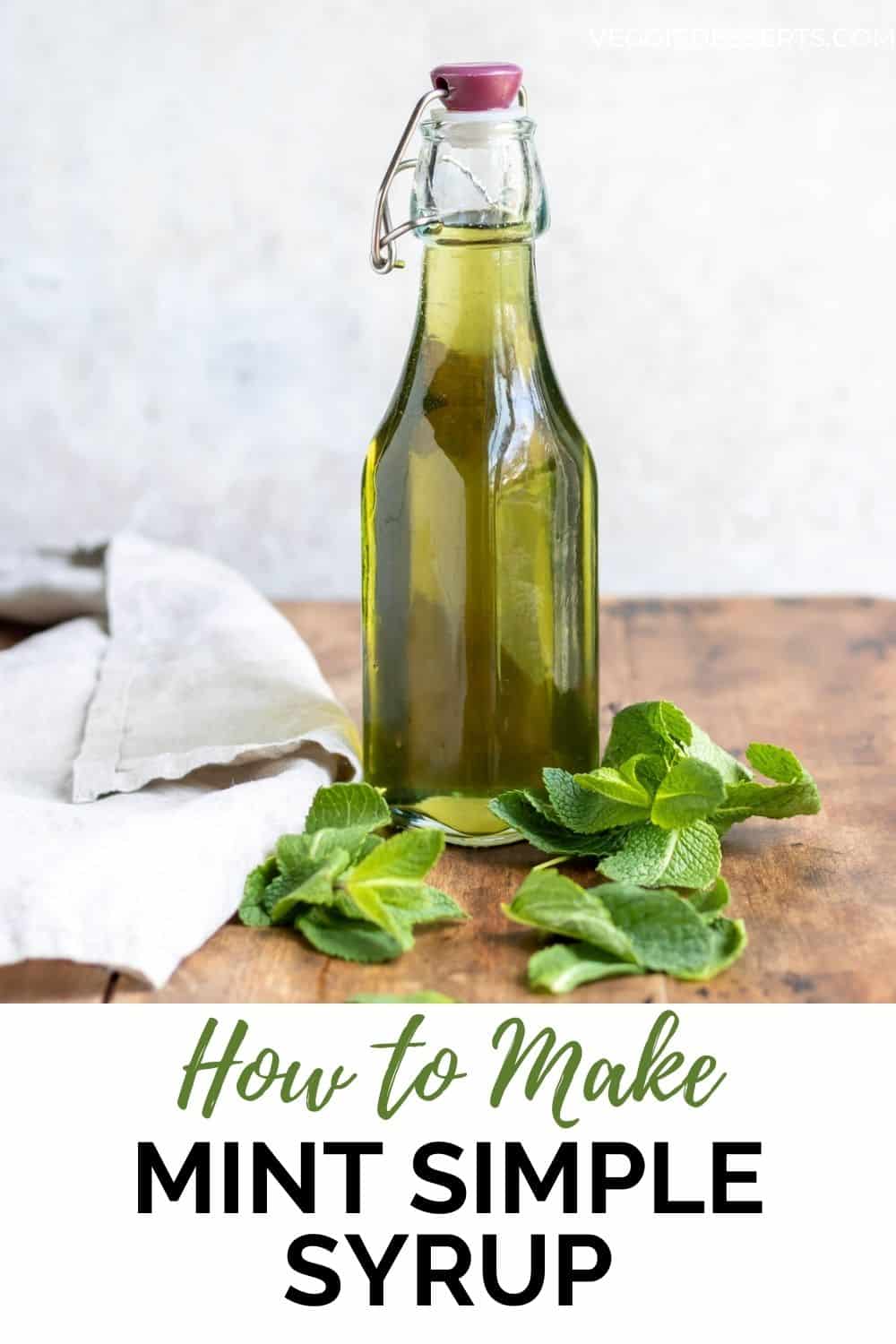 Bottle of syrup on a table, with text: How to make mint simple syrup.