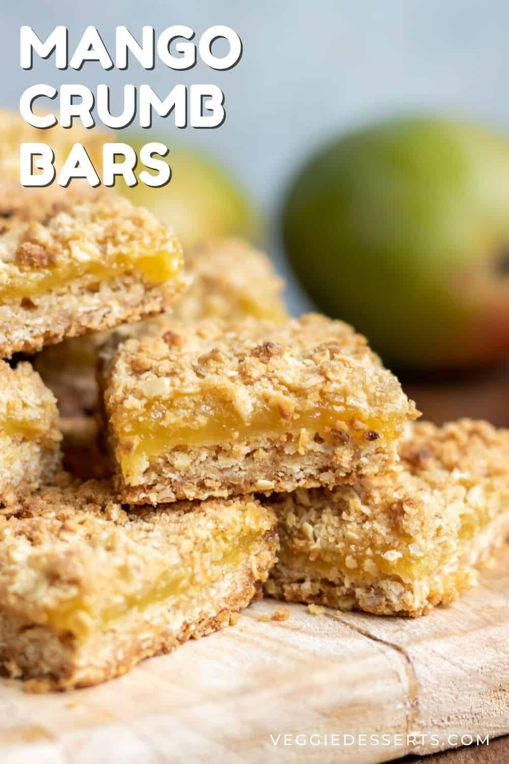 Bars on a wooden board, with text: Mango Crumb Bars.