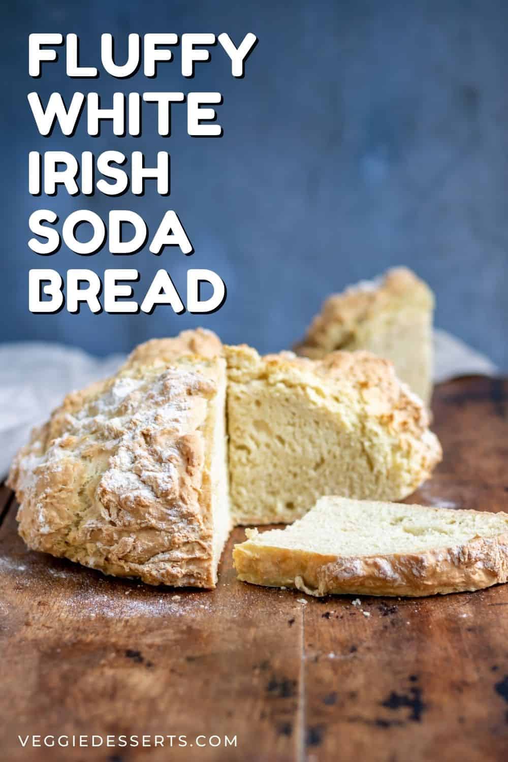 Loaf of white soda bread with a piece cut out.