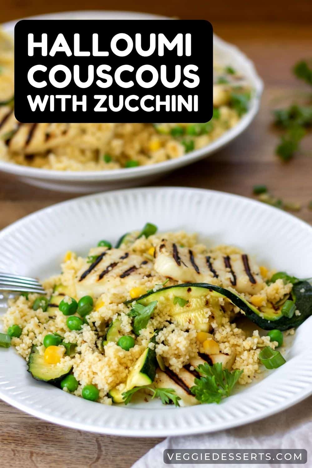 Plate of couscous with text: Halloumi Couscous With Zucchini.