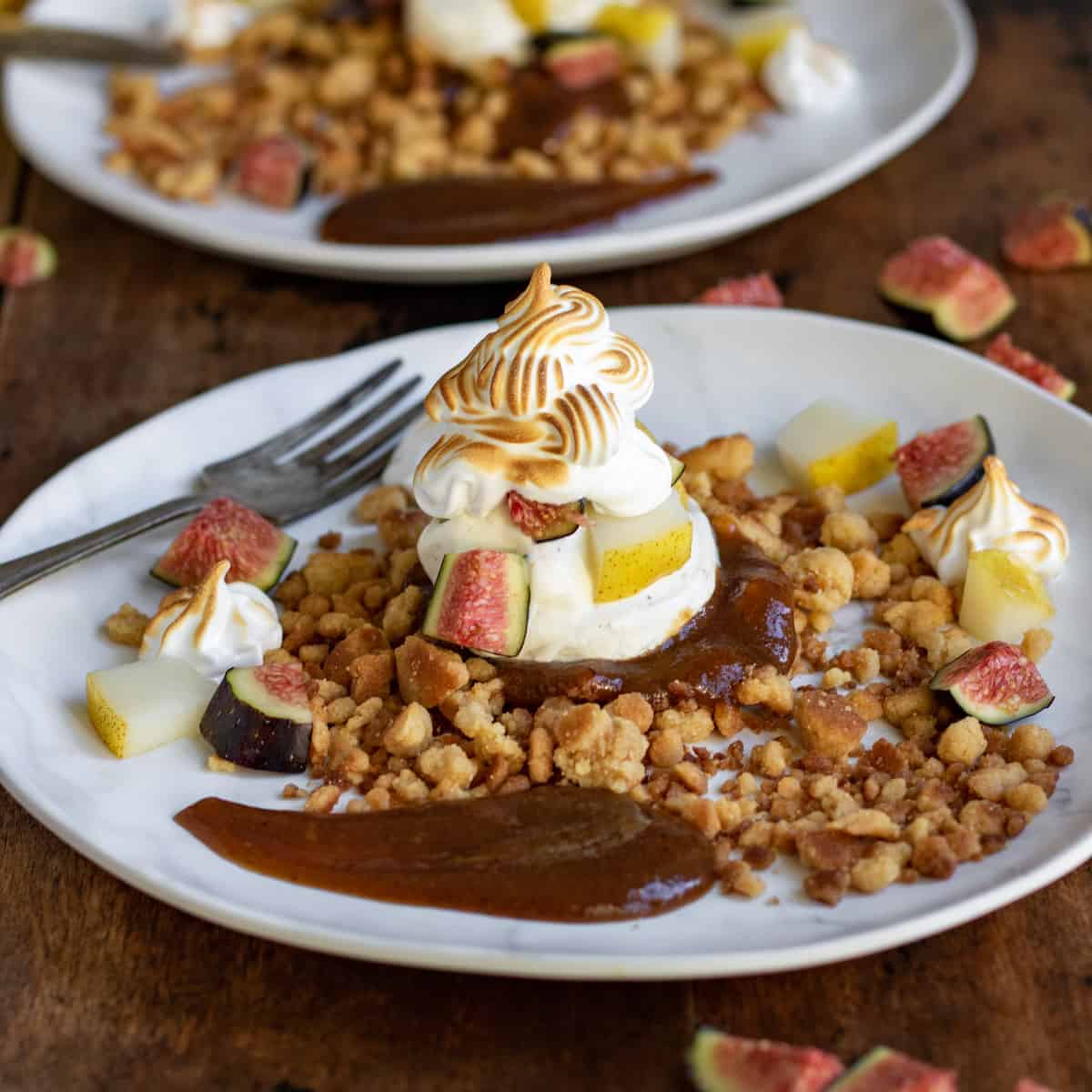 Deconstructed fig and pear crumble on a plate.