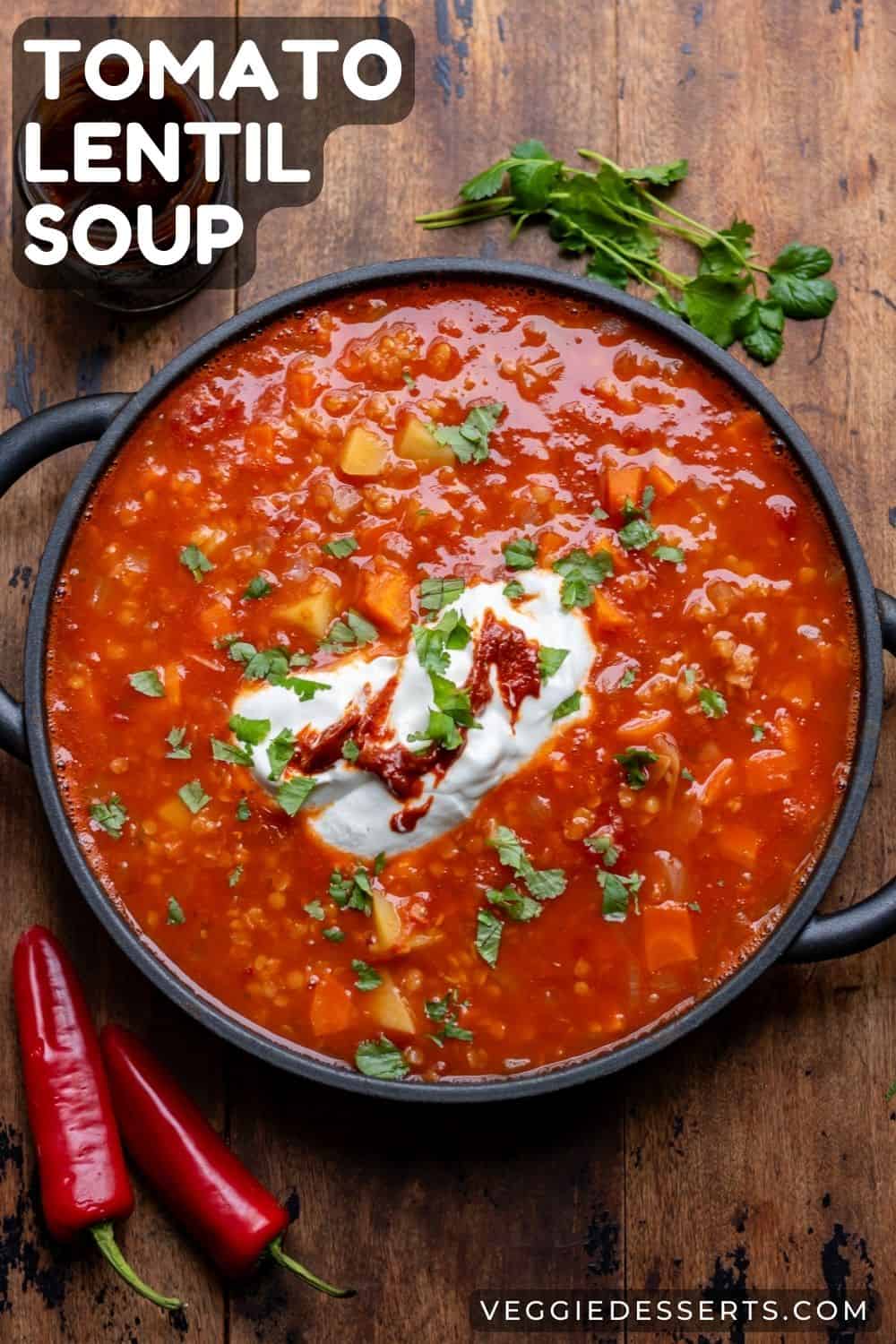 A serving dish of soup, with text: Tomato Lentil Soup.