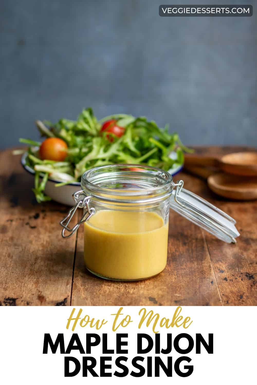 Table with salad and a jar of homemade dressing, with text: How to Make Maple Dijon Dressing.