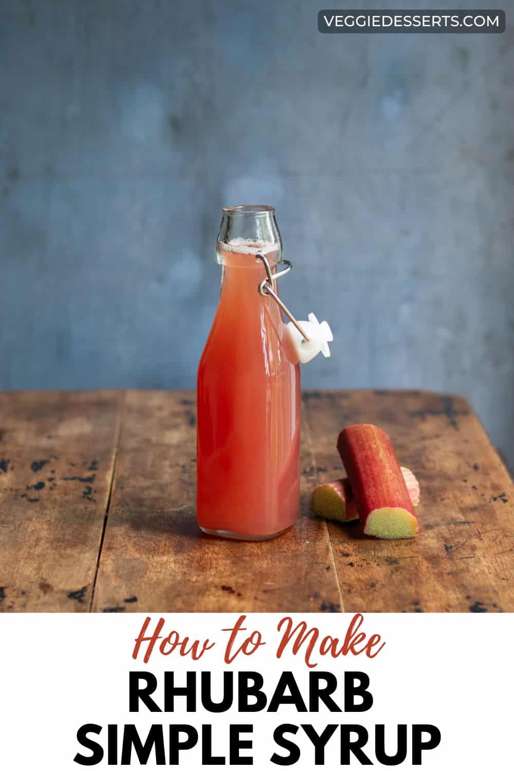 Bottle of syrup on a table with text: How to Make Rhubarb Simple Syrup.
