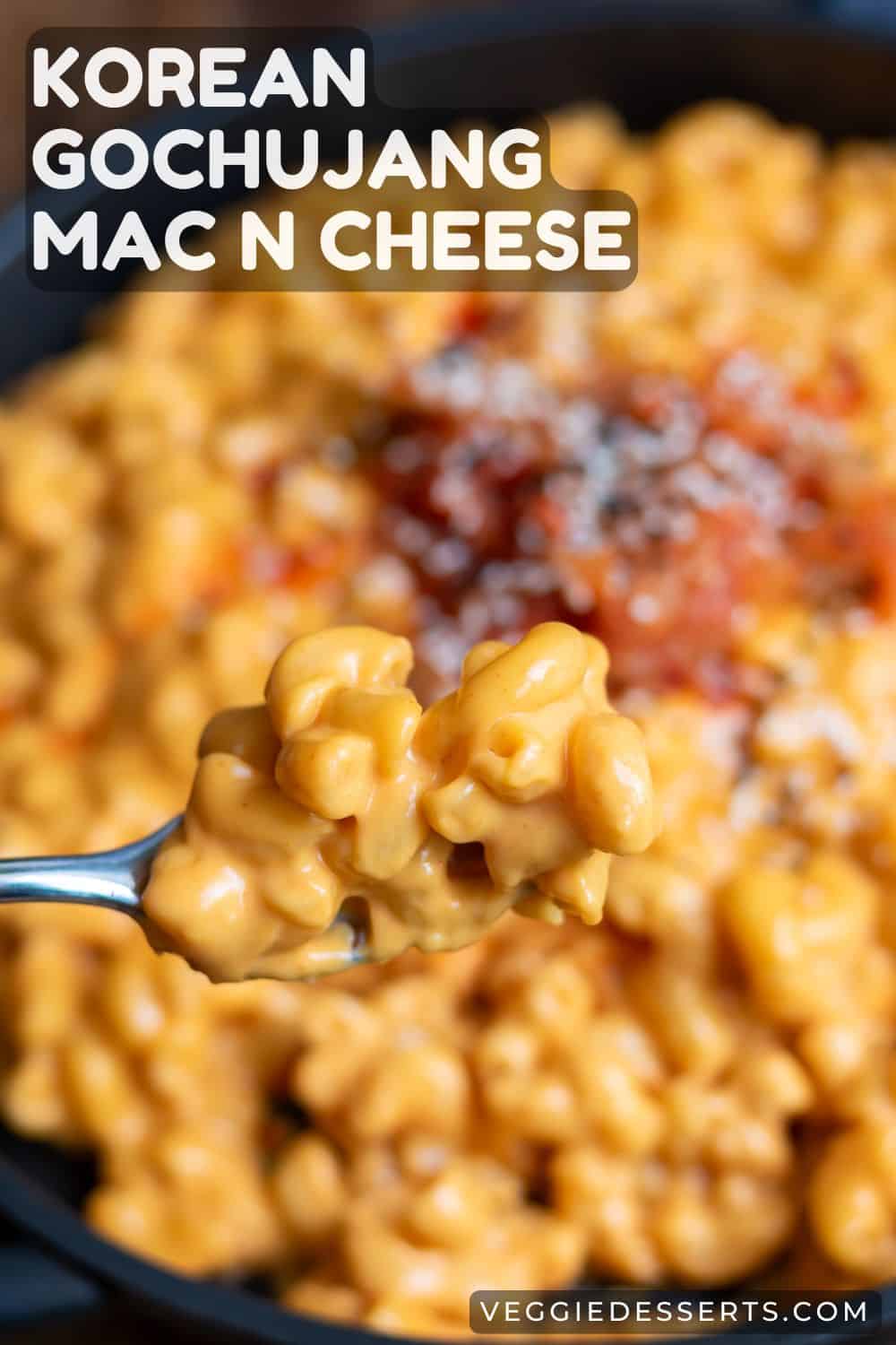 A forkful of macaroni, with text: Korean Gochujang Mac N Cheese.