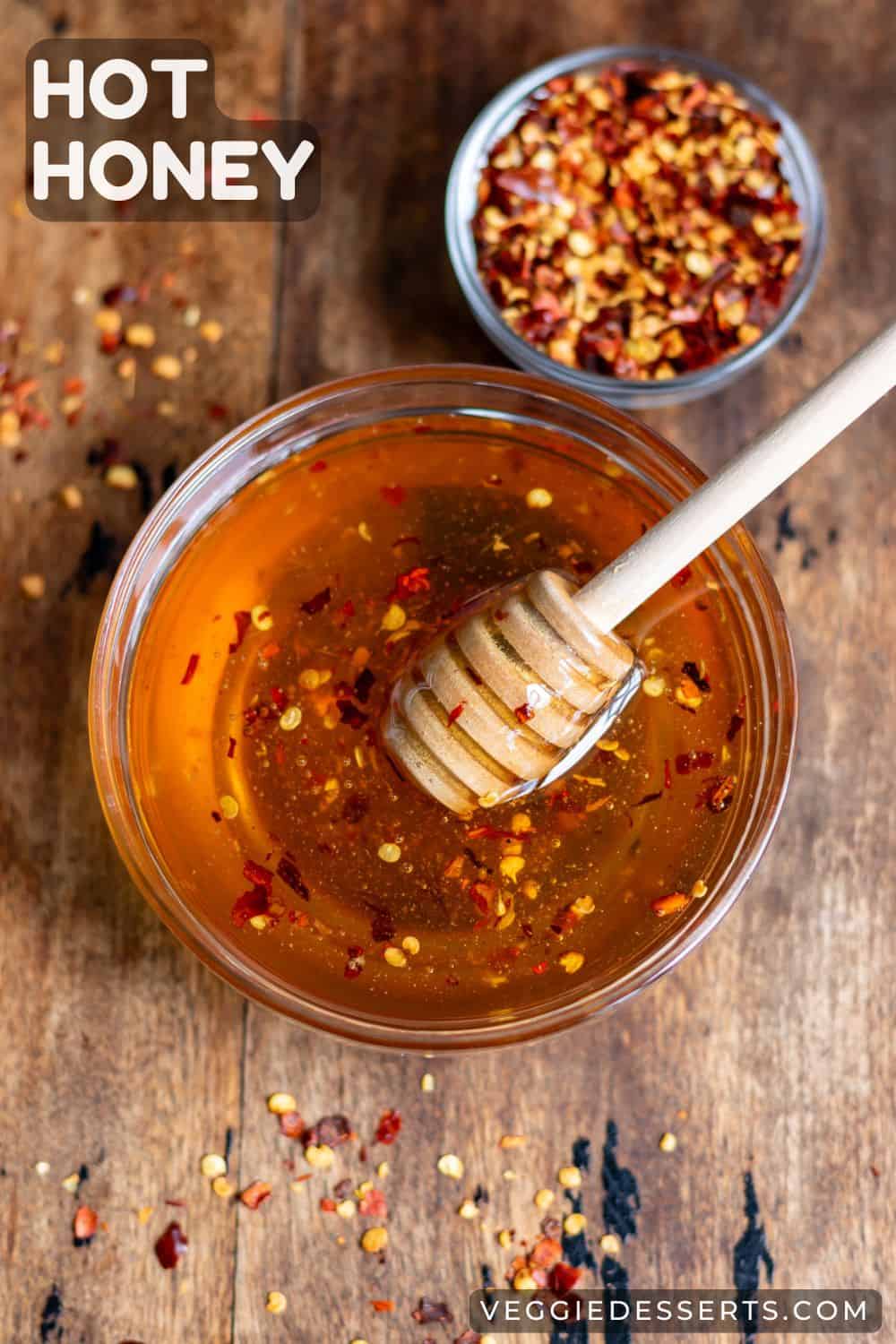 Dish of honey and bowl of chili flakes, with text: Hot Honey.
