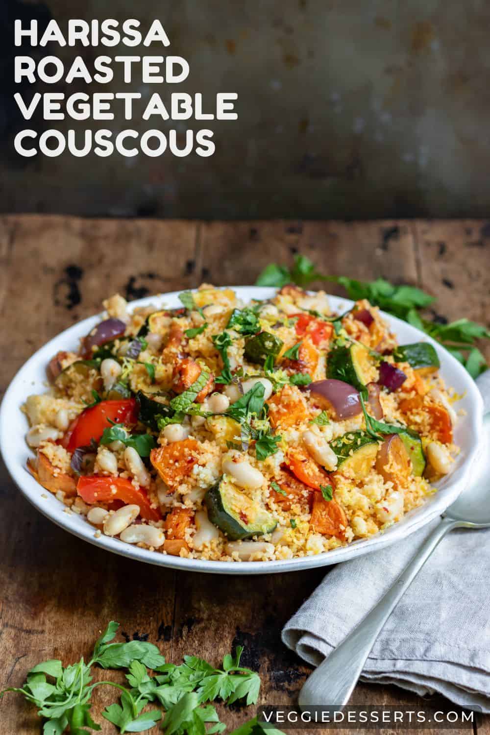 Plate of vegetable bean couscous, with text: Harissa Roasted Vegetable Couscous.