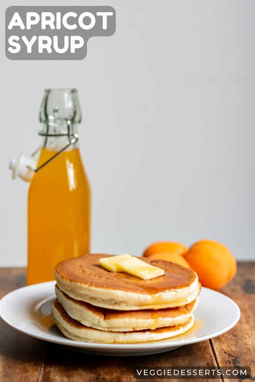 Stack of pancakes with a bottle of syrup, with text: Apricot Syrup.